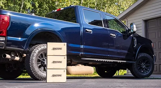 An AMSOIL oil change kit is delivered and waiting to be used.